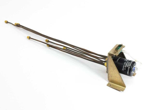 Teledyne Microwave CS38SI6-D RF switch side and rear view showing cylindrical solenoid body, brass mounting bracket, and SMA coax leads