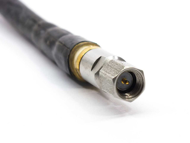 Close-up of straight SMA connector end of W.L. Gore G2R21R01011.6 RF jumper cable showing gold contact pin and stainless coupling nut
