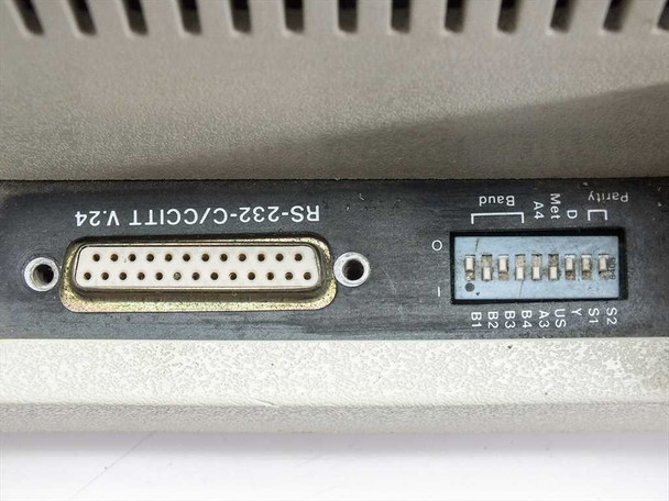 IBM 7372 rear interface panel — RS-232-C/CCITT V.24 DB-25 connector and DIP switch bank for baud rate, parity, and paper size configuration