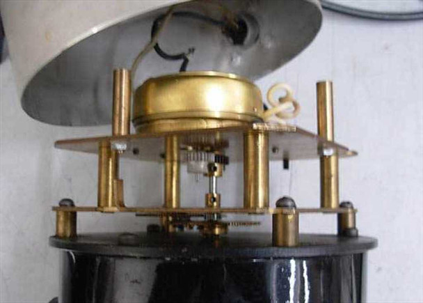 Internal gear and mechanical movement of the chronograph viewer showing brass clockwork mechanism and motor assembly