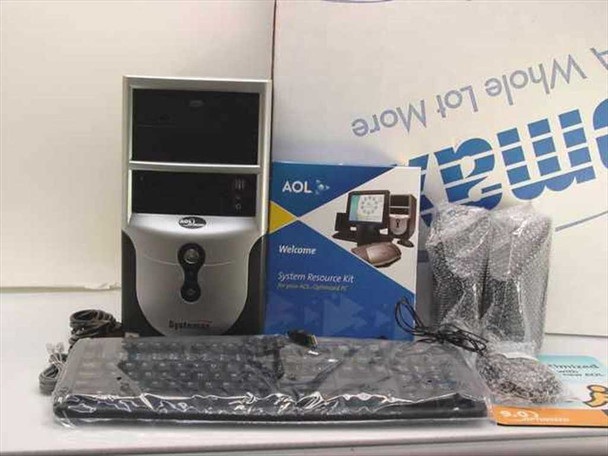 Systemax SYX-651M03 desktop PC tower shown with included accessories: keyboard, mouse, speakers, power cord, phone cord, and AOL System Resource Kit box