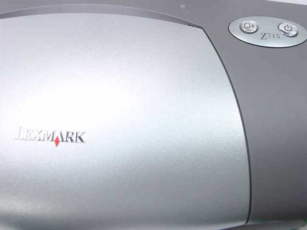 Lexmark Z715 inkjet printer close-up showing Lexmark logo and power button on silver housing