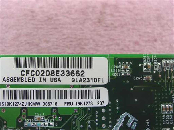 QLogic QLA2310FL PCB label close-up showing assembly number CFC0208E33662, model QLA2310FL, and IBM FRU 19K1273