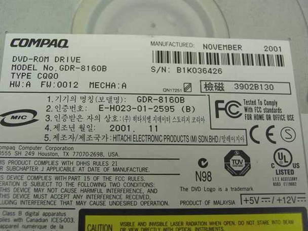 Compaq GDR-8160B bottom label showing model number, firmware revision HW:A FW:0012, manufacture date November 2001, FCC and CE certifications, and Hitachi manufacturer information