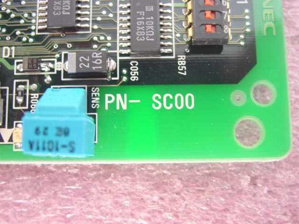 NEC PN-SC00 board close-up showing PN-SC00 silkscreen label, NEC marking, DIP switch, and component detail