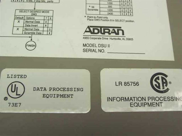 Adtran DSU II bottom label showing Model DSU II, serial number field, UL Listed and CSA certification marks, and configuration switch table