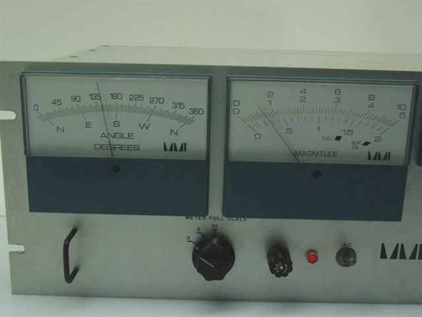 Marsh-McBirney Model 500 front panel close-up — left meter shows Angle in Degrees (0–360, N/E/S/W), right meter shows Magnitude scale, red indicator light and rotary selector visible