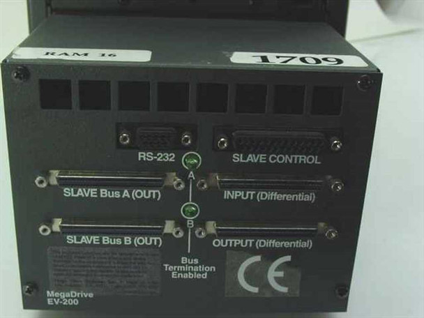 Megadrive EV-200 rear I/O panel showing RS-232 port, Slave Control connector, Slave Bus A Out, Slave Bus B Out, Input and Output differential SCSI ports, Bus Termination Enabled label, CE mark