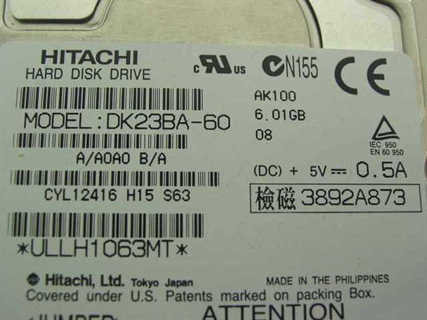 Hitachi DK23BA-60 hard disk drive label showing 6.01GB capacity, 5V 0.5A power rating, and AK100 firmware revision