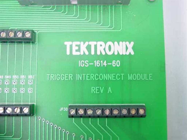 Tektronix IGS-1614-60 internal PCB label showing TEKTRONIX IGS-1614-60 TRIGGER INTERCONNECT MODULE REV A silkscreen on green circuit board with JP30 jumper block