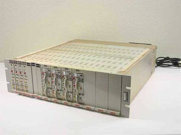 Metraplex 183-49 signal conditioner rackmount chassis – front three-quarter view showing installed plug-in modules with indicator LEDs