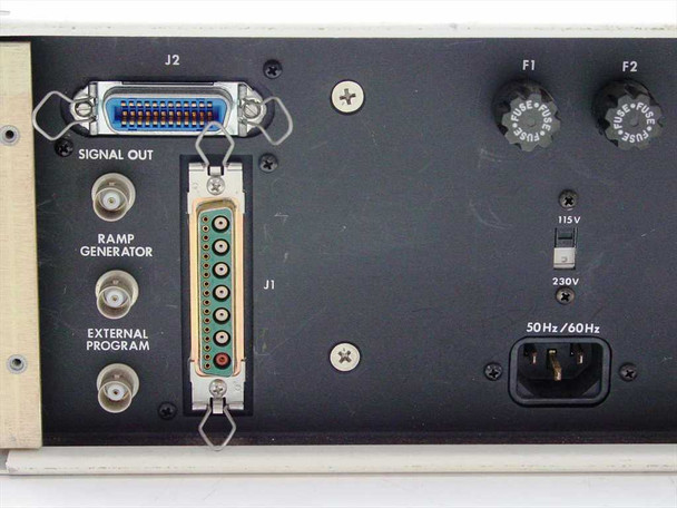 UTI 100C rear panel close-up showing J1 and J2 D-Sub connectors, BNC Signal Out, Ramp Generator, External Program, 115V/230V selector, F1/F2 fuse holders, and IEC AC inlet