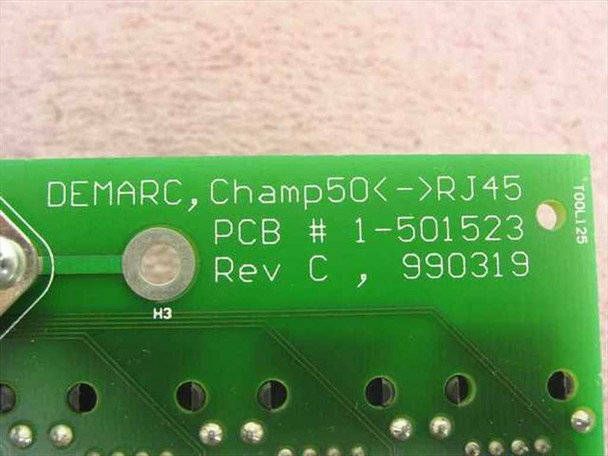 Close-up of PCB silkscreen label reading DEMARC Champ50 to RJ45, PCB 1-501523 Rev C dated 990319