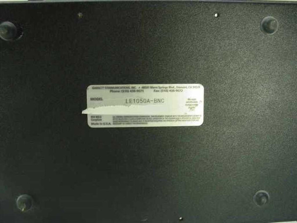 Black Box Multiport Repeater 1050 LE1050A-BNC bottom label showing model number LE1050A-BNC and Garrett Communications Inc. manufacturer information