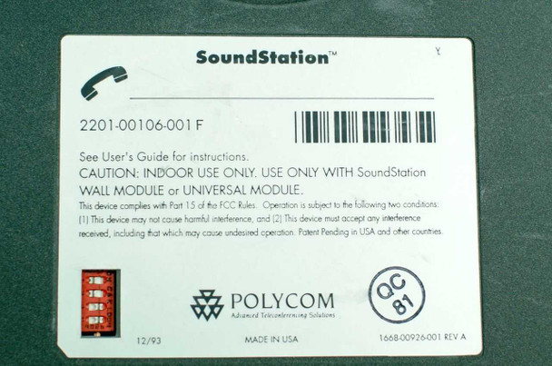 Polycom SoundStation 2201-00106-001 audio conference phone — top view showing triangular body with Polycom logo, speaker grille, and detached keypad module