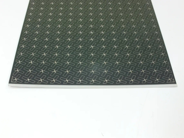 Nanosolar NanoCell CIGS solar cell — angled front corner view showing thin flexible aluminum base edge and contact grid
