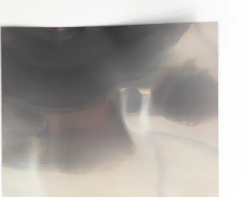 Solopower SP3 solar cell partially in protective packaging — blurred detail view