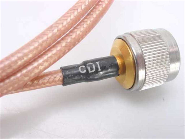 CDI crimped N-male connector close-up showing black strain relief boot with CDI marking and gold center conductor