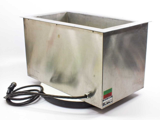 Delta Sonics DT1021 ultrasonic cleaning tank rear and side view showing stainless steel exterior with discoloration and generator cable coiled beneath