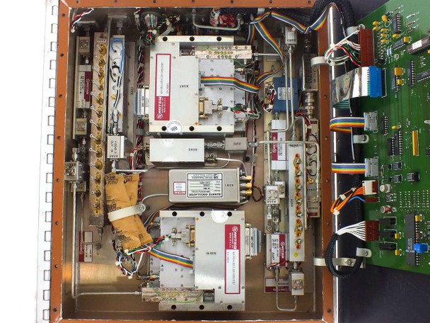 Miteq U/D-9502-61289 – internal view with enclosure lid open showing multiple RF module assemblies, bandpass filter cans, SMA interconnect cables, Wenzel oscillator, and wiring harnesses mounted to chassis