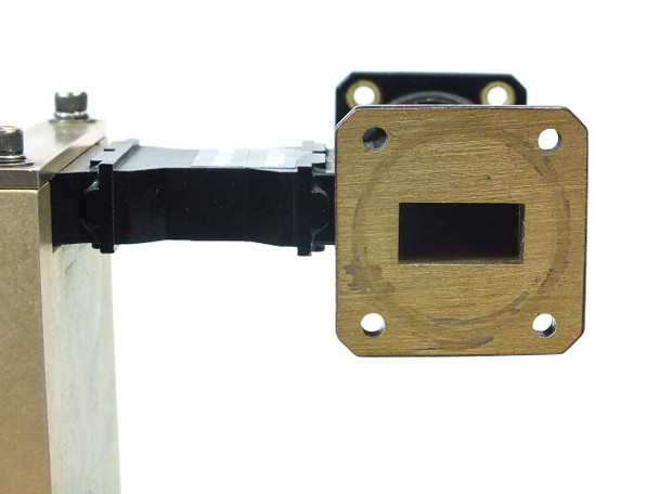 MCS 4009-0000G1 opposite end view showing second WR-75 waveguide flange port with circular wear mark on brass face