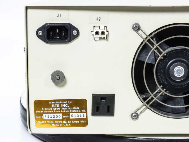 BTS PS1200 rear panel full view showing IEC inlet J1, terminal block J2, fan, duplex outlet, J4 connector, and rating label