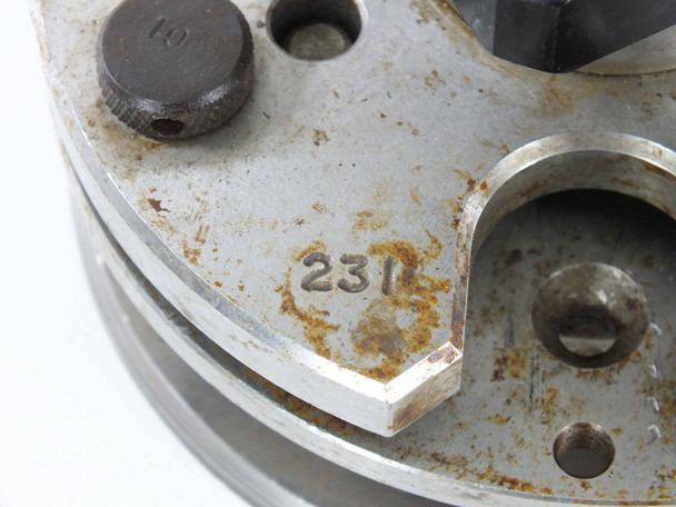 Logitech PM2A base plate close-up showing embossed LOGITECH SCOTLAND markings and surface rust