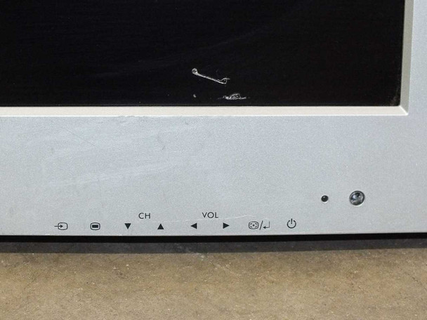 Dell W3000 front panel controls — CH and VOL buttons, input selector, power button, and LED indicator; screen scratch visible in upper portion of panel