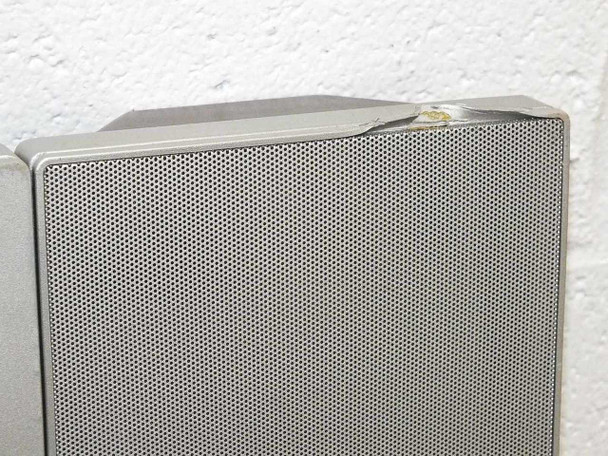 Dell W3000 left integrated speaker enclosure — close-up showing top corner with minor damage/chipping to the plastic housing