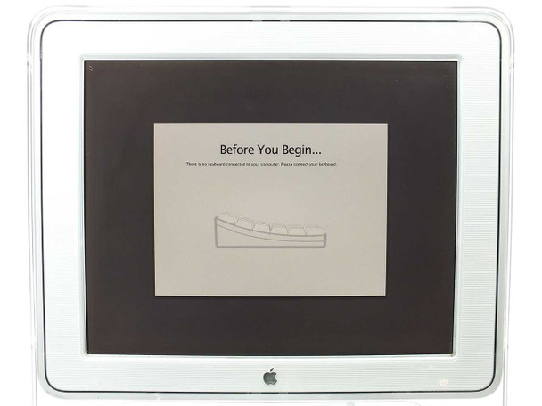 Apple M7649 Studio Display 17-inch LCD monitor – powered on showing macOS 'Before You Begin' keyboard setup screen, confirming display function