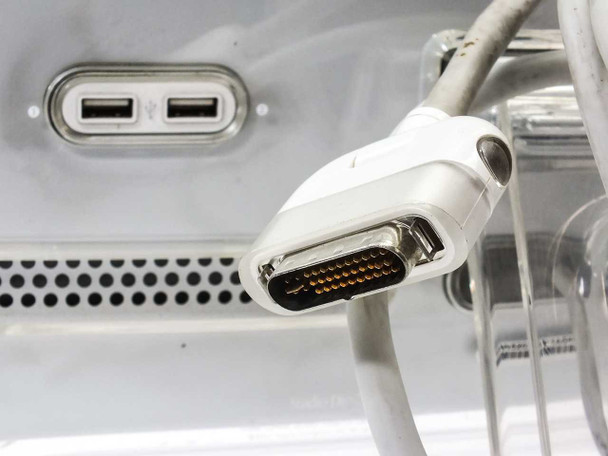 Apple M7649 Studio Display – closeup of ADC (Apple Display Connector) cable end with dual USB ports visible on rear panel