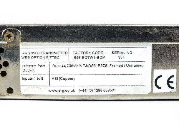 ARG 1900 1945-EQTW1-BOM T3/DS3 ASI Media Combiner Transmitter — rear panel angled view showing multiple BNC ASI input connectors, dual IEC power inlets, DB9 serial port, and RJ-45 network port; top cover shows heavy staining