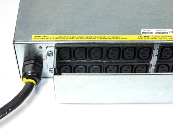Techniques PT630D rear panel showing one bank of 12 IEC C13 output receptacles with yellow warning caution label and input power cable connector
