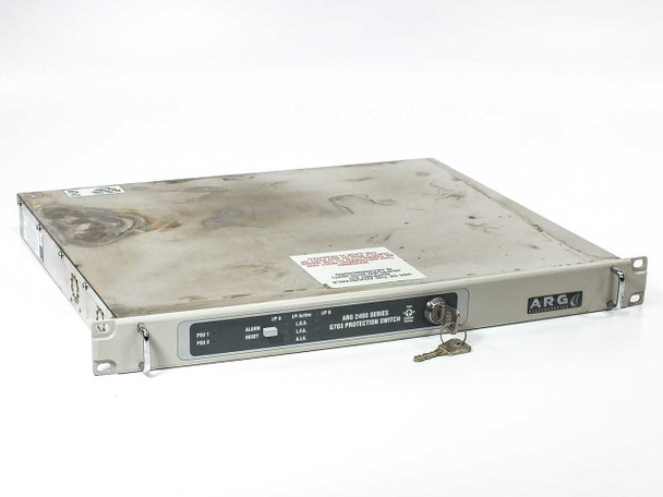 ARG 2400 Series G.703 Protection Switch – rear panel close-up showing BNC ports 1-2, Alarms D-sub, Remote IEC port, dual IEC AC inlets, and power label indicating 100-240V 1-phase dual supply