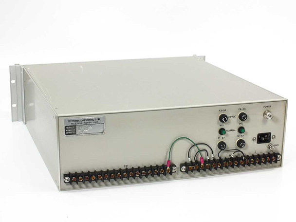 Telecomm Engineering 142001-1 Network Mimic Panel – rear panel showing IEC AC power inlet, 28VDC label, PS1/PS2 power supply indicators, fuse holders F1–F4, NORMAL status LED, terminal blocks TB1 and TB2, and GND lug