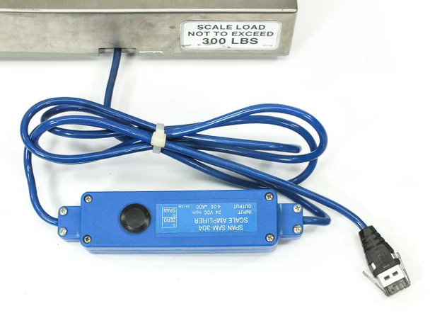 SPAN SAM-304 scale amplifier module with cable coiled, showing 300 LBS load sticker on scale edge and RJ45 connector