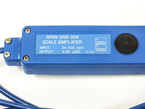 SPAN SAM-304 Scale Amplifier label closeup showing INPUT 24 VDC nom., OUTPUT 4-20 ADC, Zero and Span adjustment button