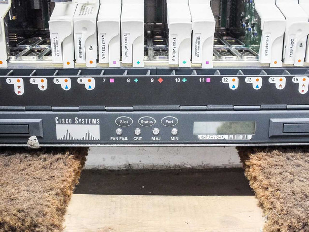 Cisco ONS 15454 bottom front panel showing slot numbering 3–15, Cisco Systems logo, and Slot/Status/Port display with FAN FAIL, CRIT, MAJ, MIN indicators