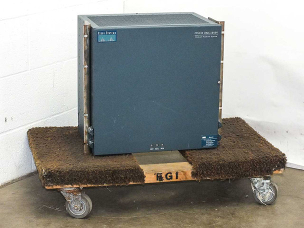 Cisco ONS 15454 optical network shelf assembly front view, closed enclosure on rolling dolly, Cisco Systems logo visible