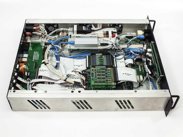 Americom AST3100 interior view with lid removed showing internal PCBs, wiring harnesses, power supply, and Americom-labeled circuit boards