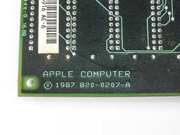 Apple 820-0207-A PCB corner close-up — silkscreen reads 'APPLE COMPUTER © 1987 820-0207-A' with barcode label
