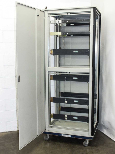 Varian VZC6967R4 rackmount cabinet – front view with door fully open showing full interior, multiple slide rails, and caster base
