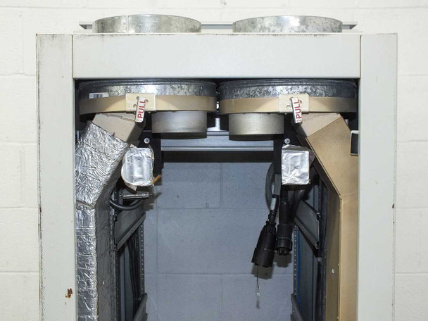 Xicom Technology rack cabinet — top front opening showing dual fan housings with foil-insulated air ducts and multi-pin power connectors