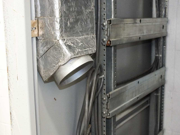 Xicom Technology rack cabinet — interior upper side view showing foil-wrapped air duct plenum and round duct outlet with rack rail channel