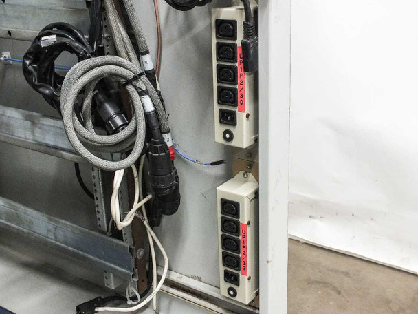 Xicom Technology rack cabinet — interior panel showing two vertical IEC C13 PDU strips (6-outlet each) with red identification labels