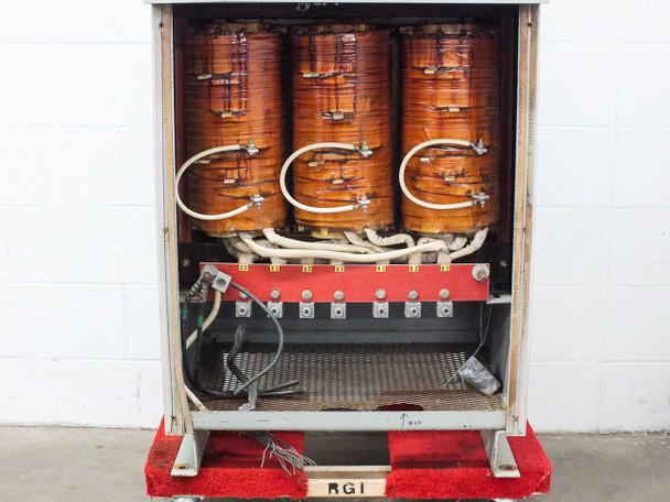 Matra Electric 6175432L – interior view showing three copper-wound transformer coils and terminal connection bus bar