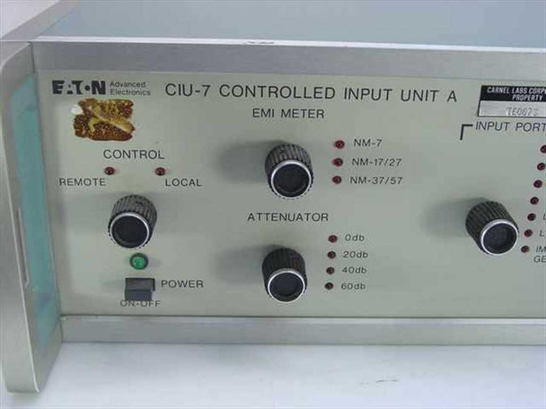 Eaton CIU-7 front panel close-up — EMI Meter label, Control Remote/Local switch, Attenuator selector (0/20/40/60 dB), NM-7/NM-17/27/NM-37/57 indicator lights, and Power on/off switch