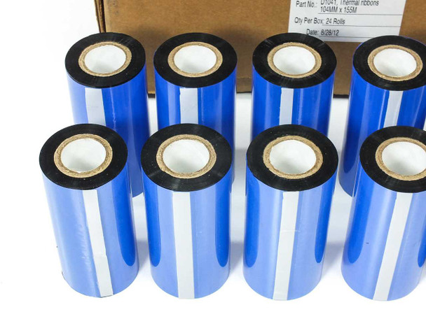 Close-up of eight D1041 104mm wax resin thermal transfer ribbon rolls standing upright with shipping box in background