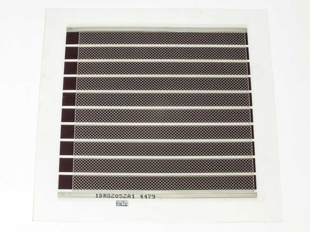 Konarka Power Plastic Model 110 flexible solar cell — front face showing dark brown OPV stripe pattern with metallic grid collector lines on clear flexible substrate