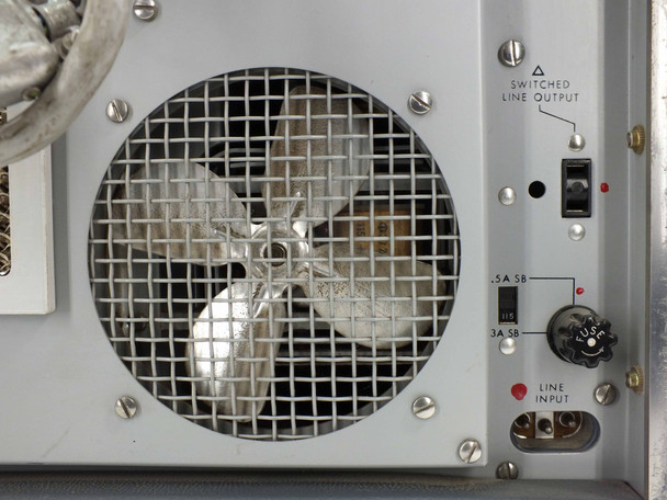 HP 8551A rear panel close-up — cooling fan with wire guard, SWITCHED LINE OUTPUT toggle, 0.5A SB and 3A SB fuse holders, and LINE INPUT connector